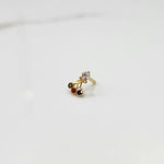 Gold ring with square clear stone and multicolor gemstone drop design