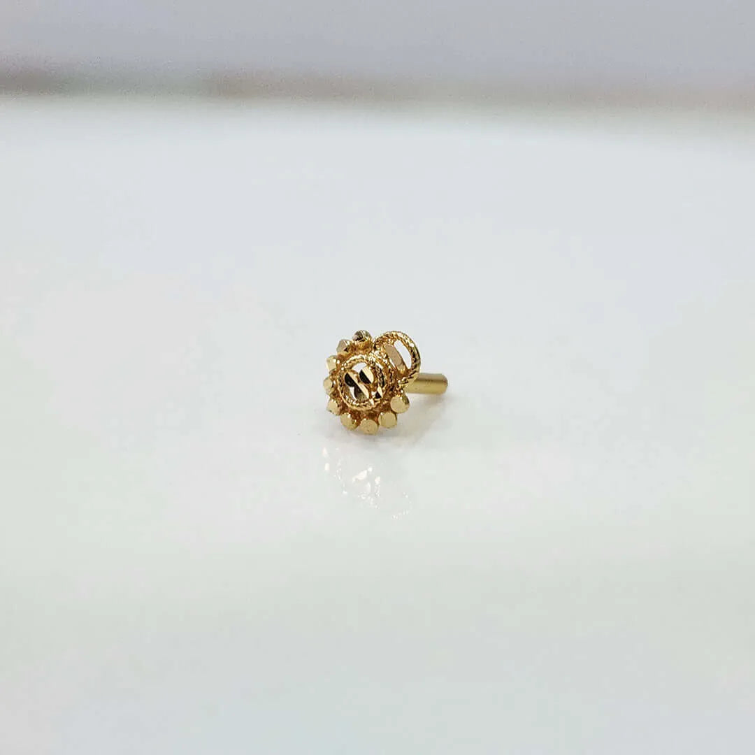 Side view of a round gold nose pin with beaded border and straight post fitting