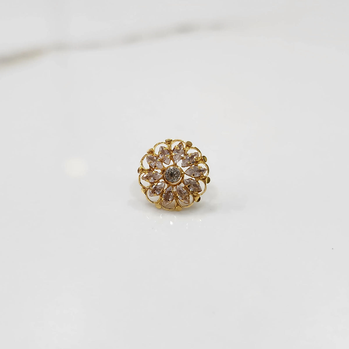 Gold round ring with clear gemstones, front view