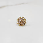 Gold round ring with clear gemstones, front view