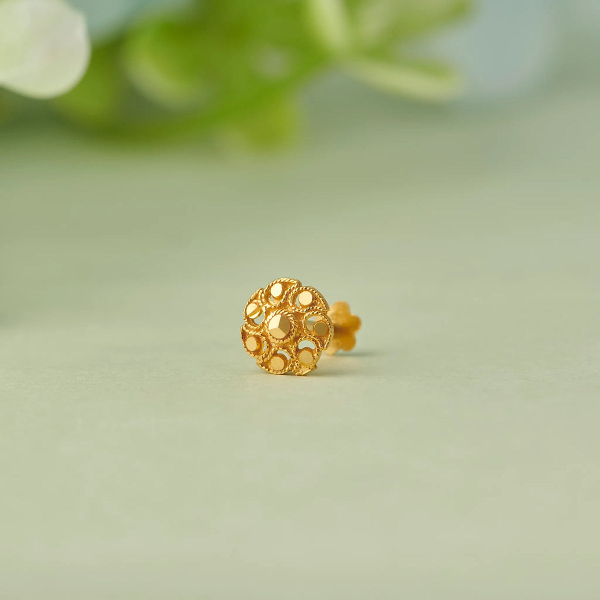 Gold round stud earring with lattice circle cutout design