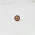 Gold round nose pin with ruby-red stones, product shot