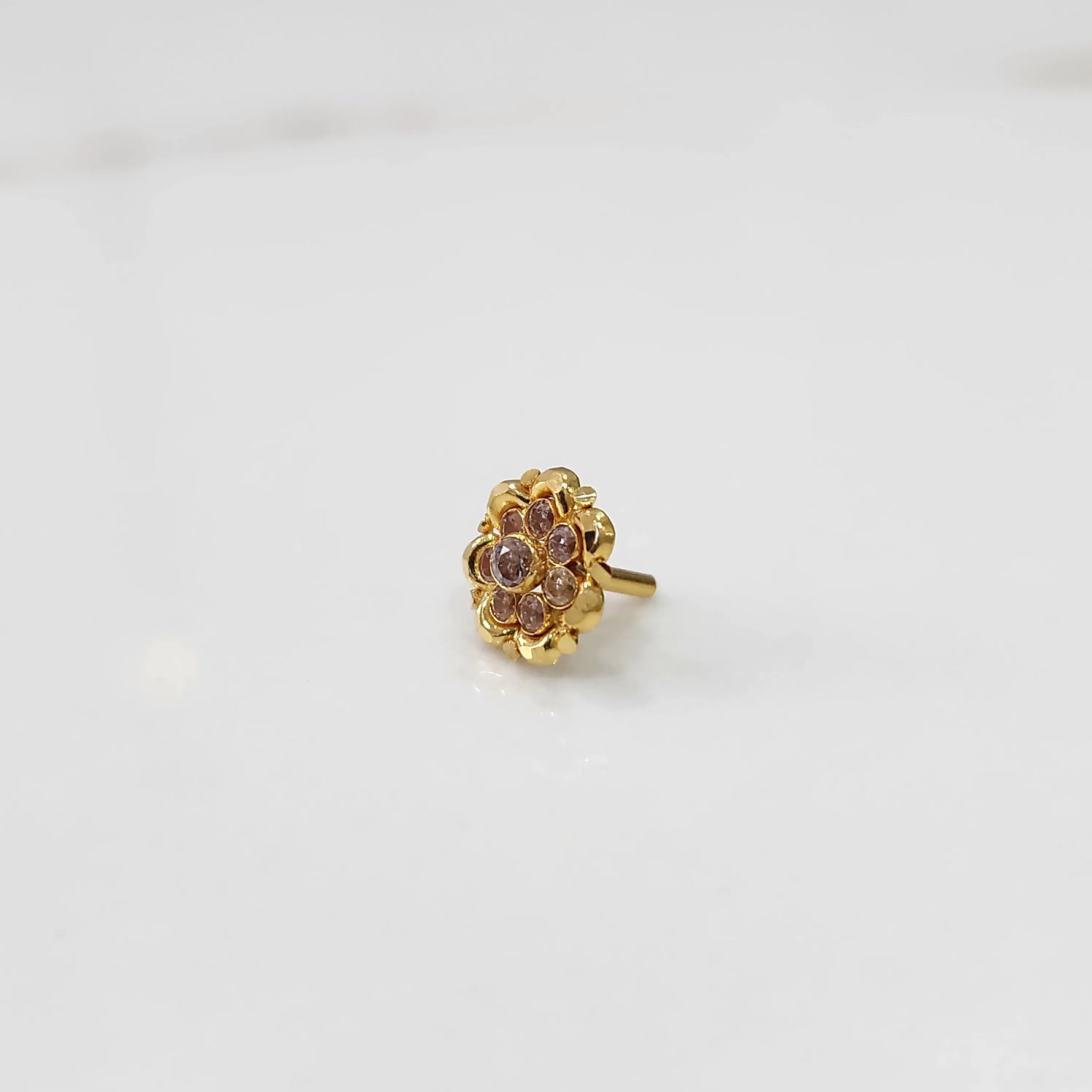 Gold ring with sculpted petal design and champagne stone detailing