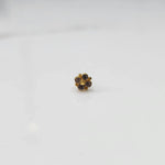 Gold floral nose pin with smoky topaz stones, product shot