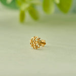 Gold stud earring with snowflake-style filigree design