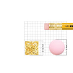 Gold star-flower nose pin size comparison next to a pencil eraser, measuring 5.40mm versus 6mm eraser