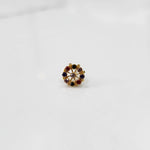 A gold star-frame stud earring with multicolor stones