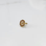 Gold star-frame nose pin with pink cabochon stones on white