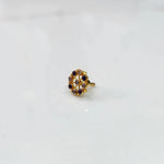 Side view gold pin nose with floral gemstone setting