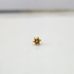 Simple gold nose pin design small star shape on white background