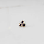 Gold ring with three-stone cluster in blue and clear stones
