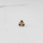 Top view of gold ring with brown and clear stone cluster
