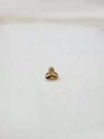 Simple gold nose pin design minimal three leaf pattern on white surface