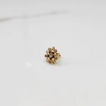 Gold cocktail ring with floral design and multicolor gemstone accents
