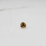 Gold ring with blue and purple gemstone round floral design, front view
