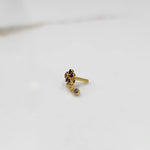 Antique-style gold ring with blue-toned stones in floral dangle pattern