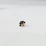 Gold ring with blue sapphire floral cluster design, front view