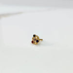 Antique-style gold ring with multicolor stones in leaf-petal pattern, angled view