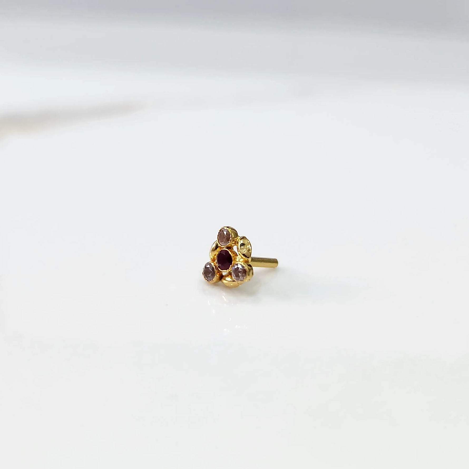 Gold ring with multicolor purple-toned leaf-petal design, front view