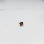 Front view of gold ring featuring multicolor gemstone cluster in round floral pattern