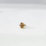 Antique-style gold ring with pink-toned stones in scalloped petal pattern