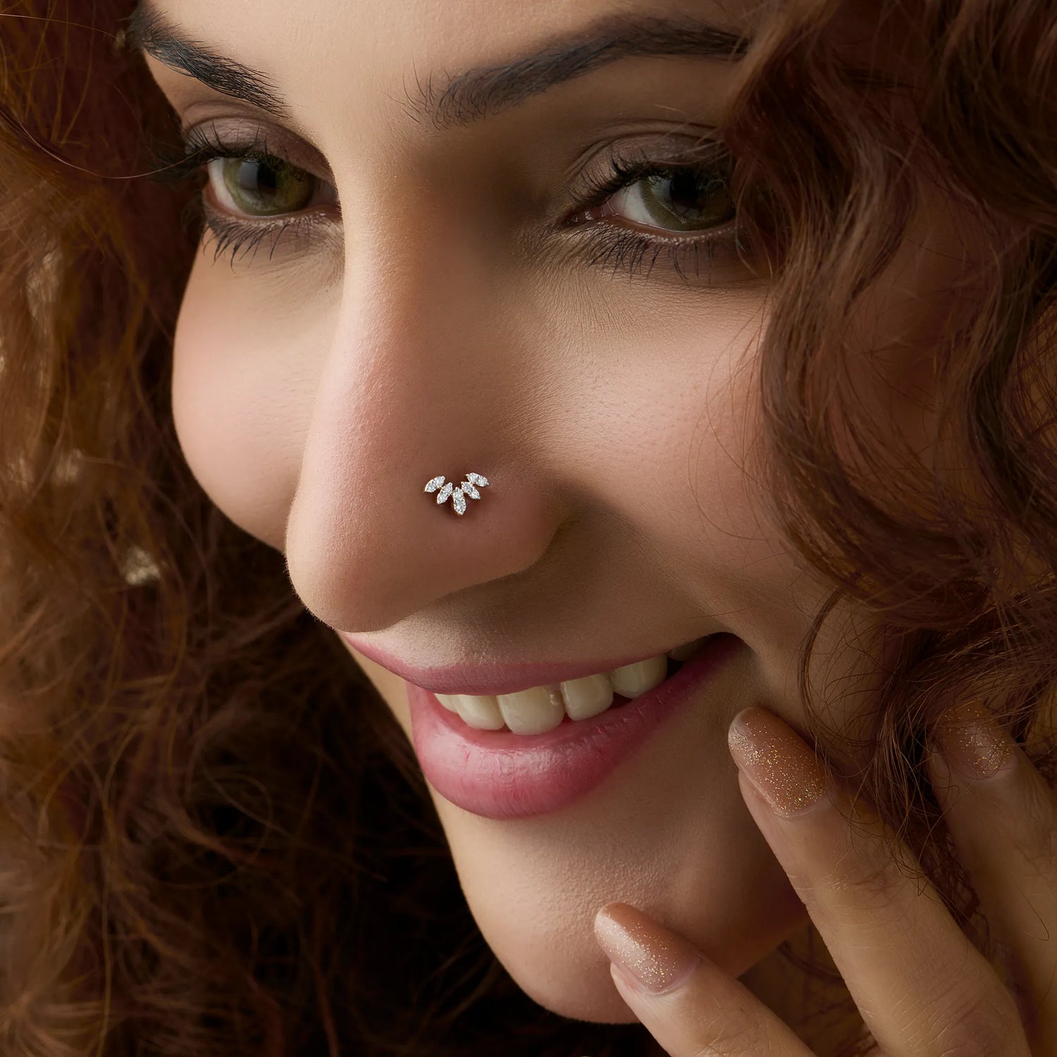 Woman wearing fancy gold nose pin close-up portrait