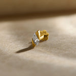 Stone Gold Nose Pin close-up with diamond-shaped stone in a polished gold setting on a soft background