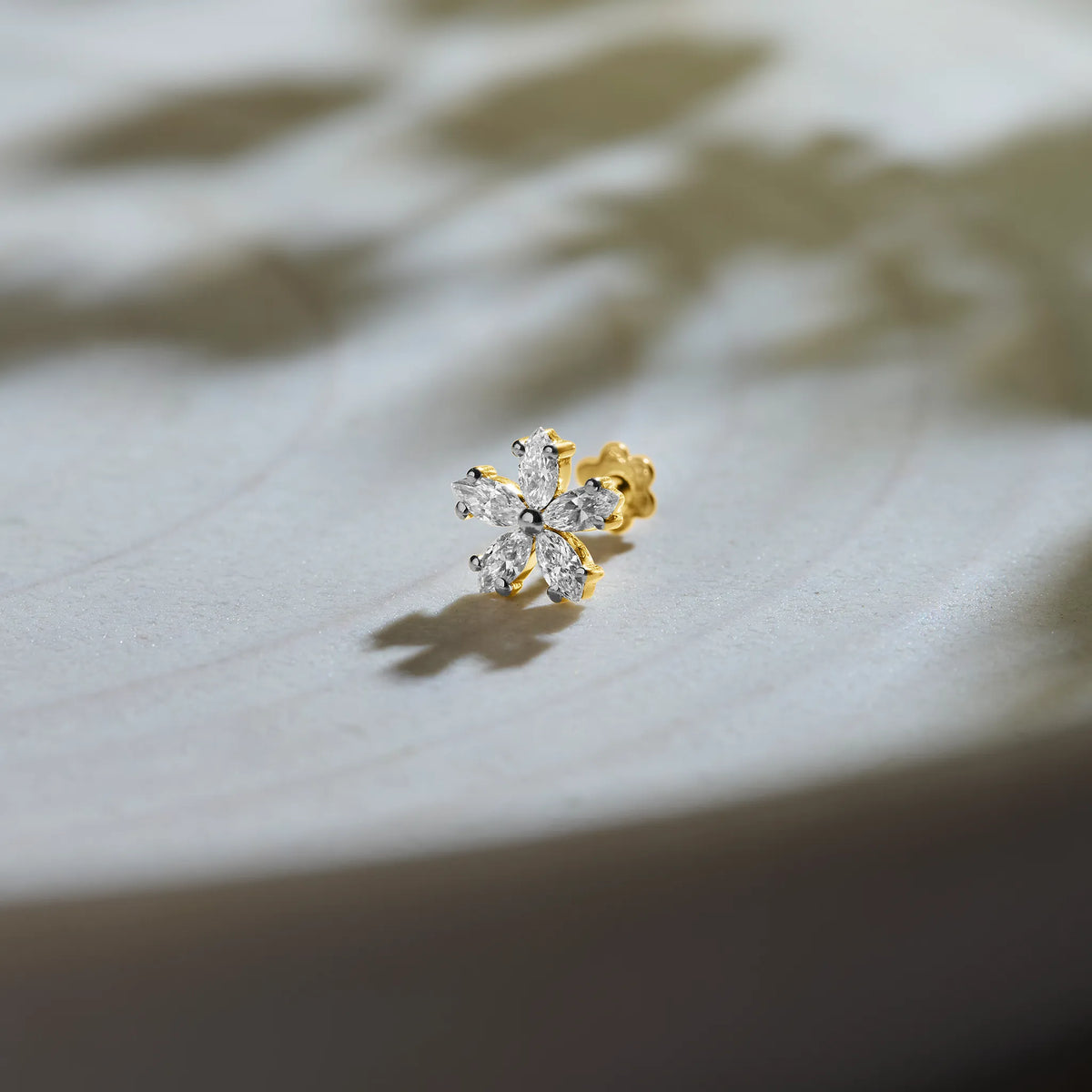 Six-petal flower diamond stud earring with marquise-cut petals in gold