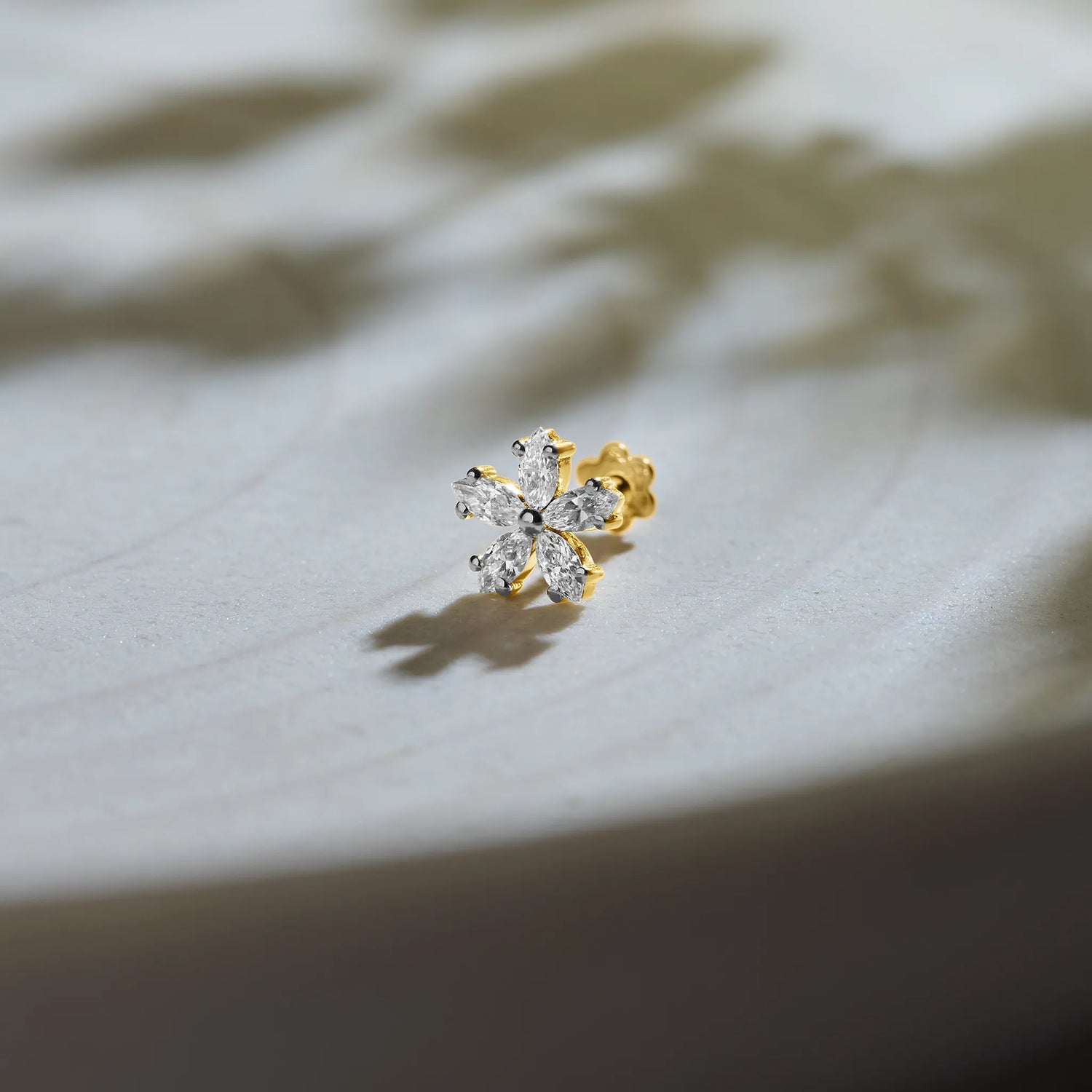 Six-petal flower diamond stud earring with marquise-cut petals in gold