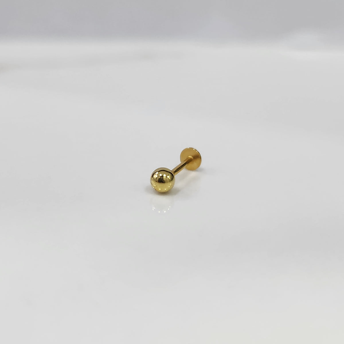 Minimalist gold ball stud for cartilage or tragus piercing