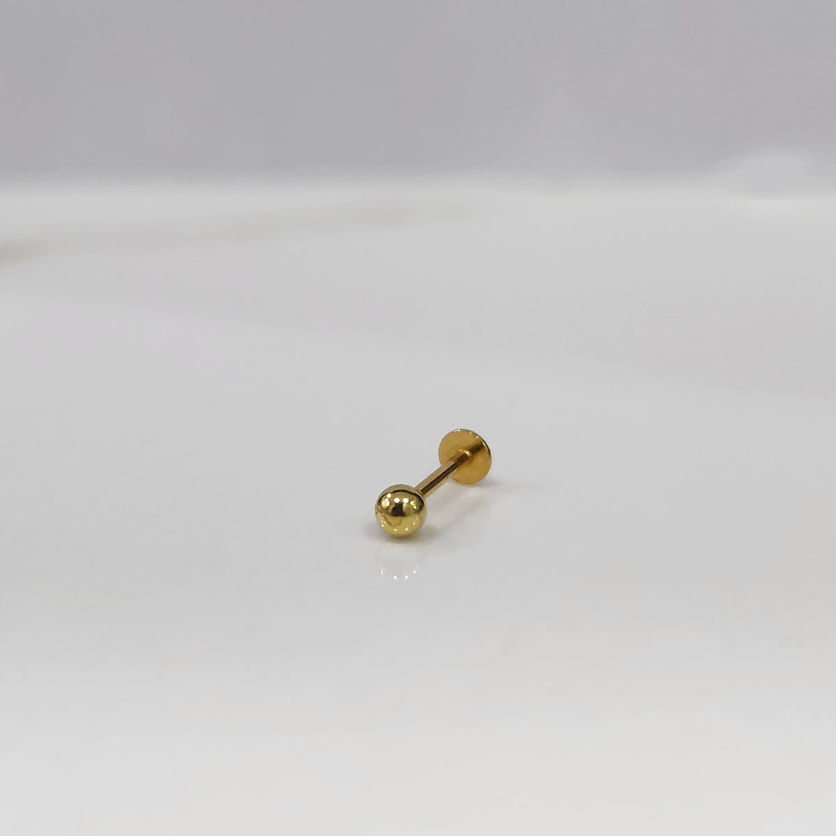 Minimalist gold ball stud for cartilage or tragus piercing