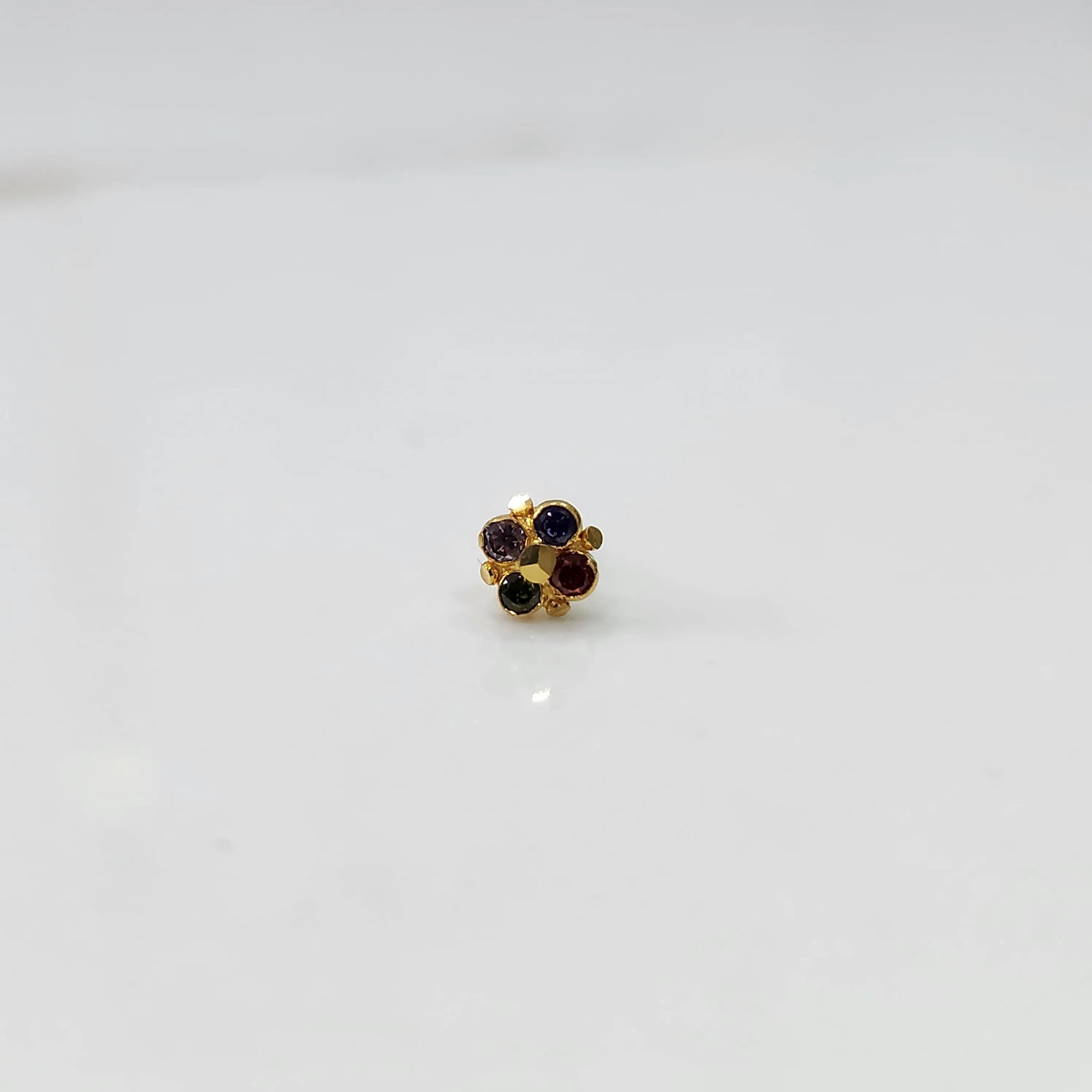 Gold cluster nose pin with multicolor gemstone detailing