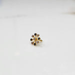 Elegant gold stud with eight-stone black and clear gem design, product close-up