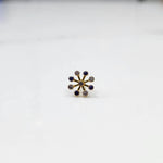 Close-up of a full-bloom purple gemstone cluster ring