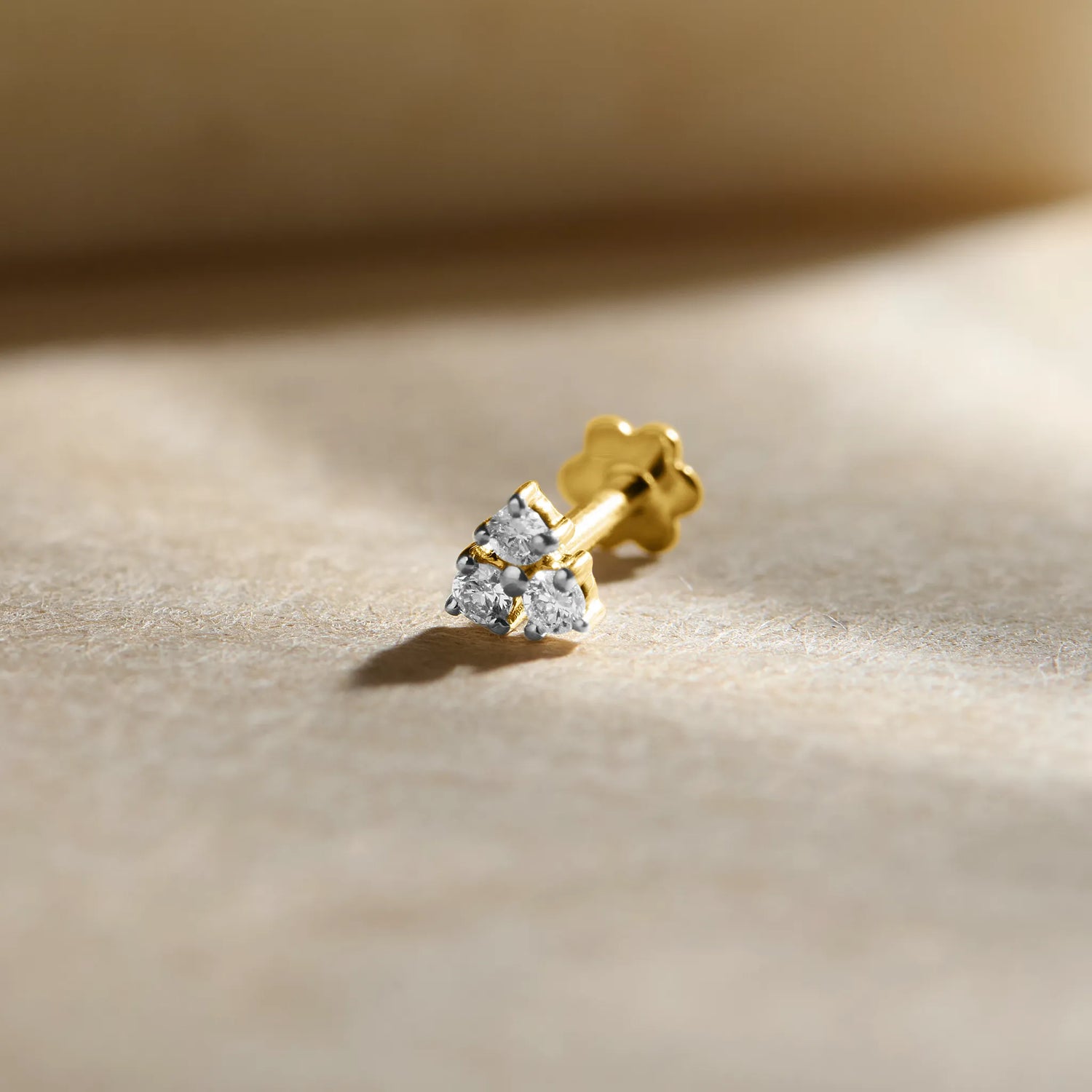 Gold ki nose pin price close-up image of floral diamond nose pin