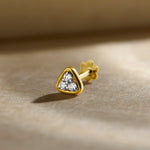 Gold Nose Pin close-up with heart-shaped stone set in polished gold on a soft background