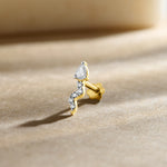 Diamond second stud price gold nose pin with pear shaped diamond and curved design on soft background