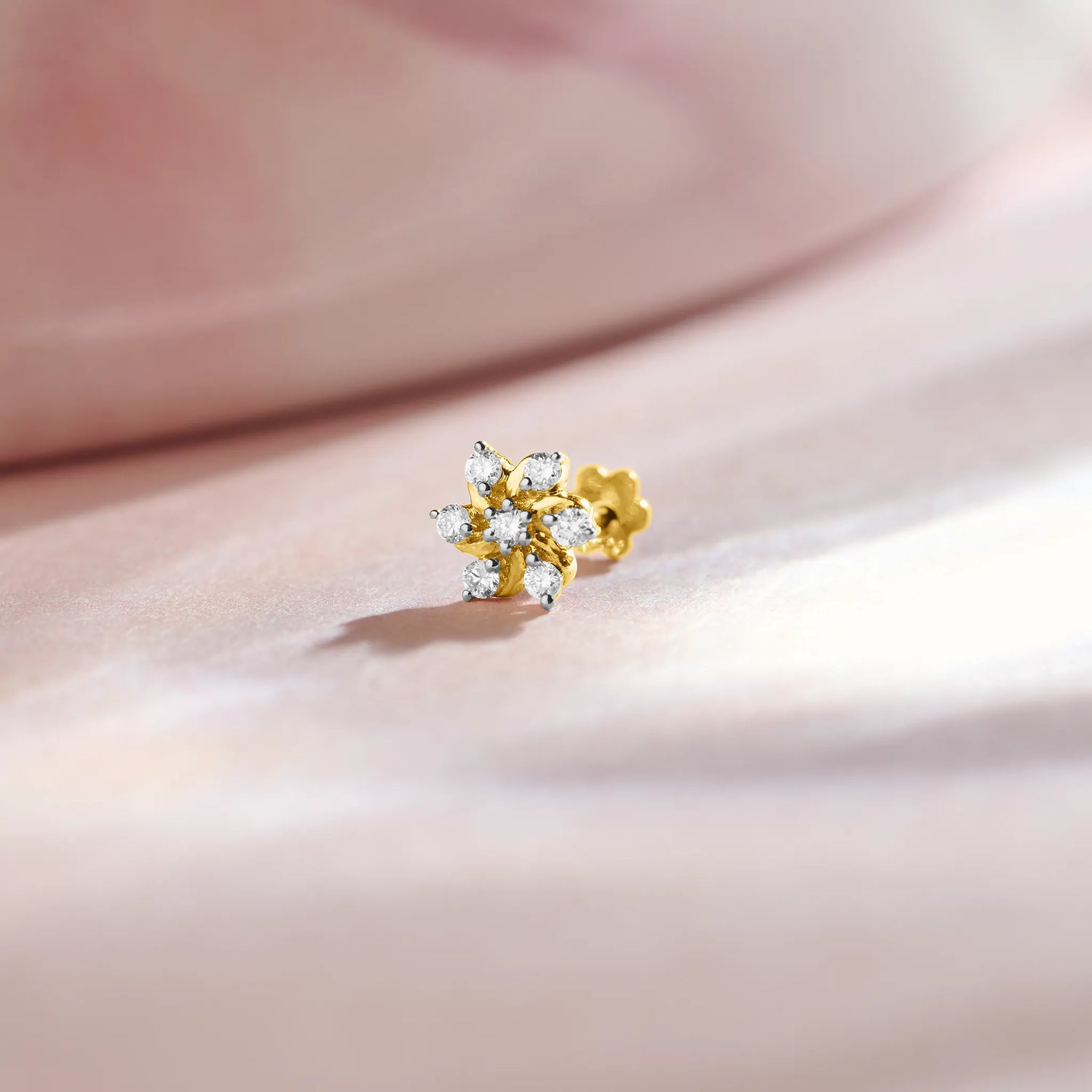 Pinwheel-style diamond flower stud earring in 14k gold