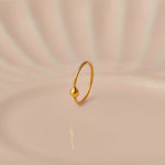 Plain gold hoop earring with small ball closure