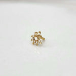 Product shot of a plain gold nose stud with filigree flower design