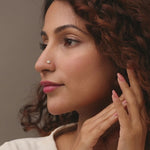 Nose pin gold worn on the nose in a close-up portrait, highlighting a graceful and elegant everyday jewelry look