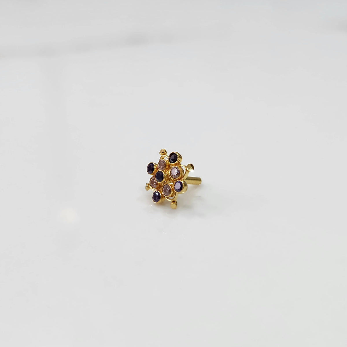 Stone gold nose pin close up with sparkling stones