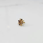 Stone gold nose pin close up with sparkling stones