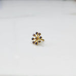 Product shot of a gold flower ring with nine amethyst stones