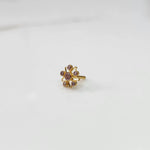 A gold nose pin shaped like a star, set entirely with soft pink-brown crystal stones