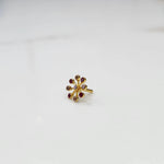 Ruby flower cluster nose pin with gold petal setting, jewelry photography