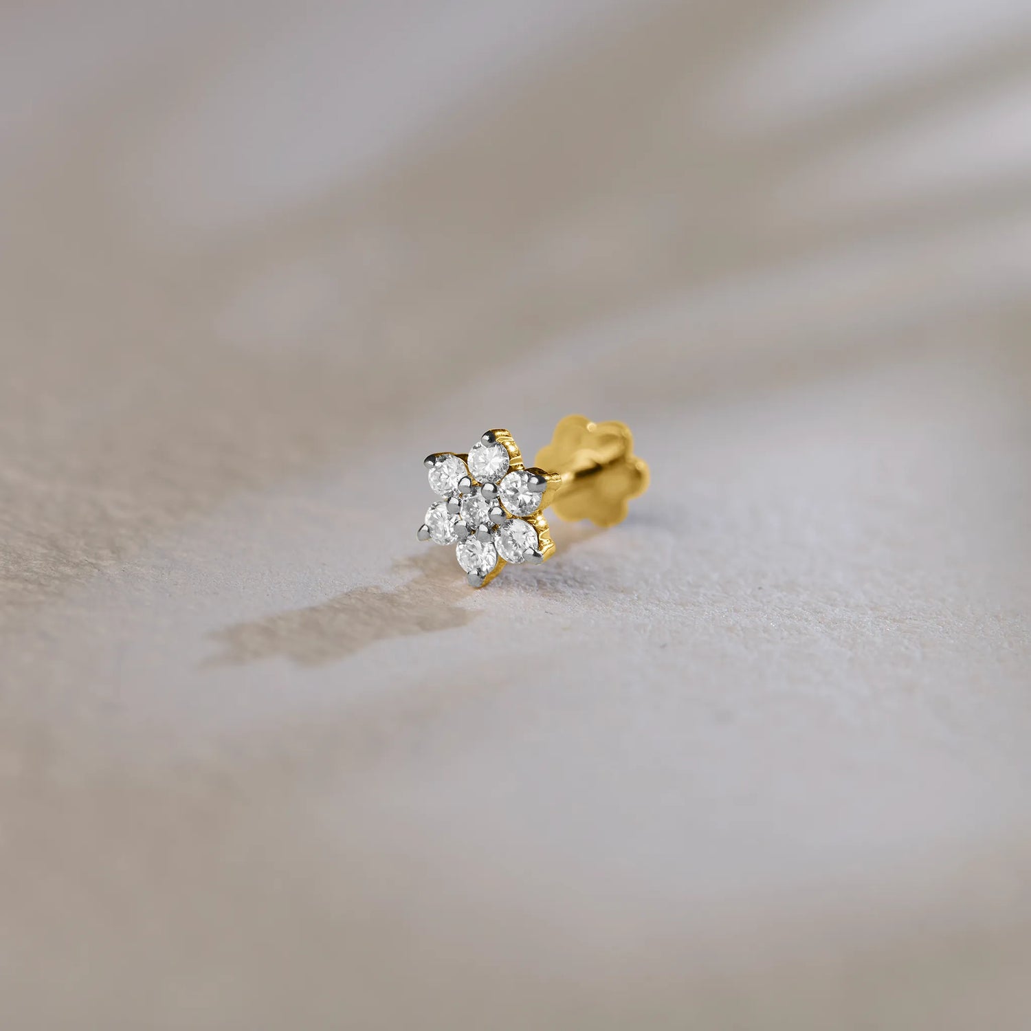Seven-stone round diamond cluster stud earring in 14k gold