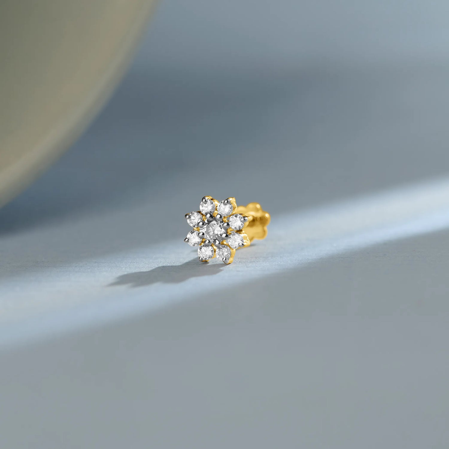 Seven-stone round diamond flower cluster stud earring in 14k gold