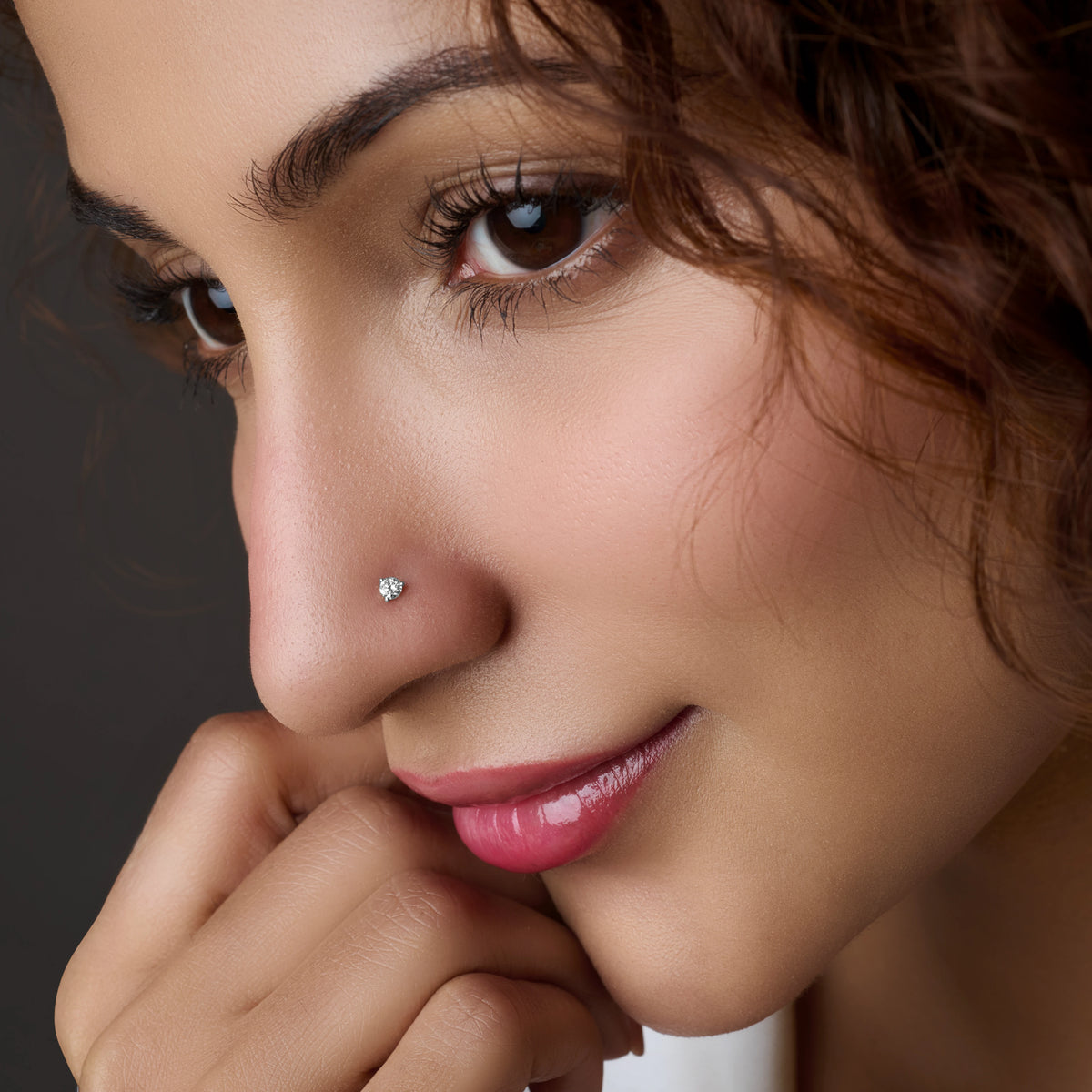 Close-up of single stone silver nose stud