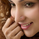 Close-up of woman wearing a silver double-stone stud nose ring